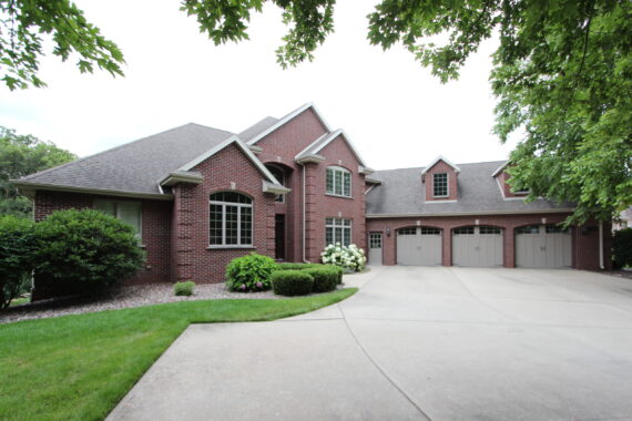 Exterior view of a two story home with three car garage