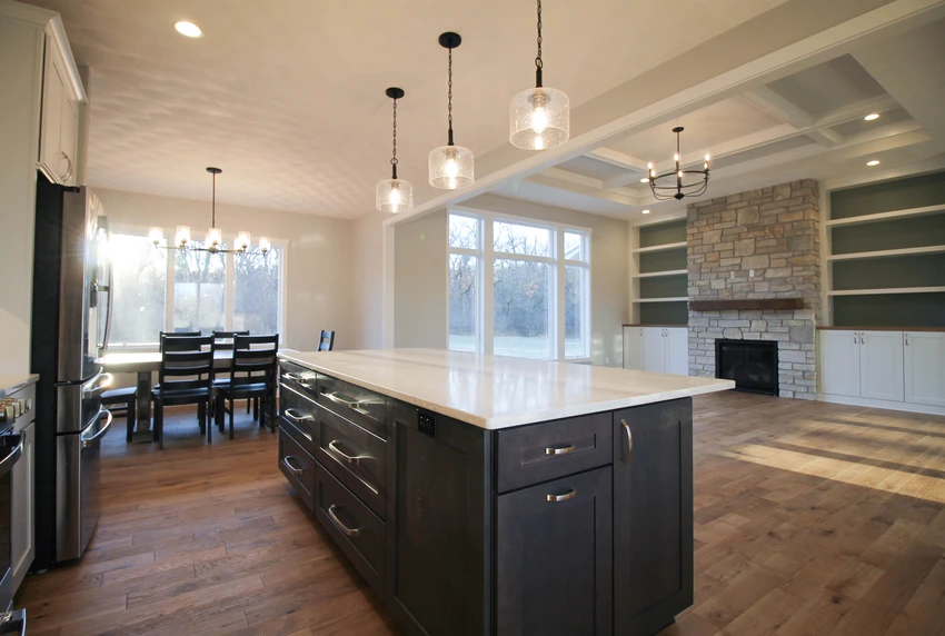 Open concept floor plan between kitchen, dining room, and living room